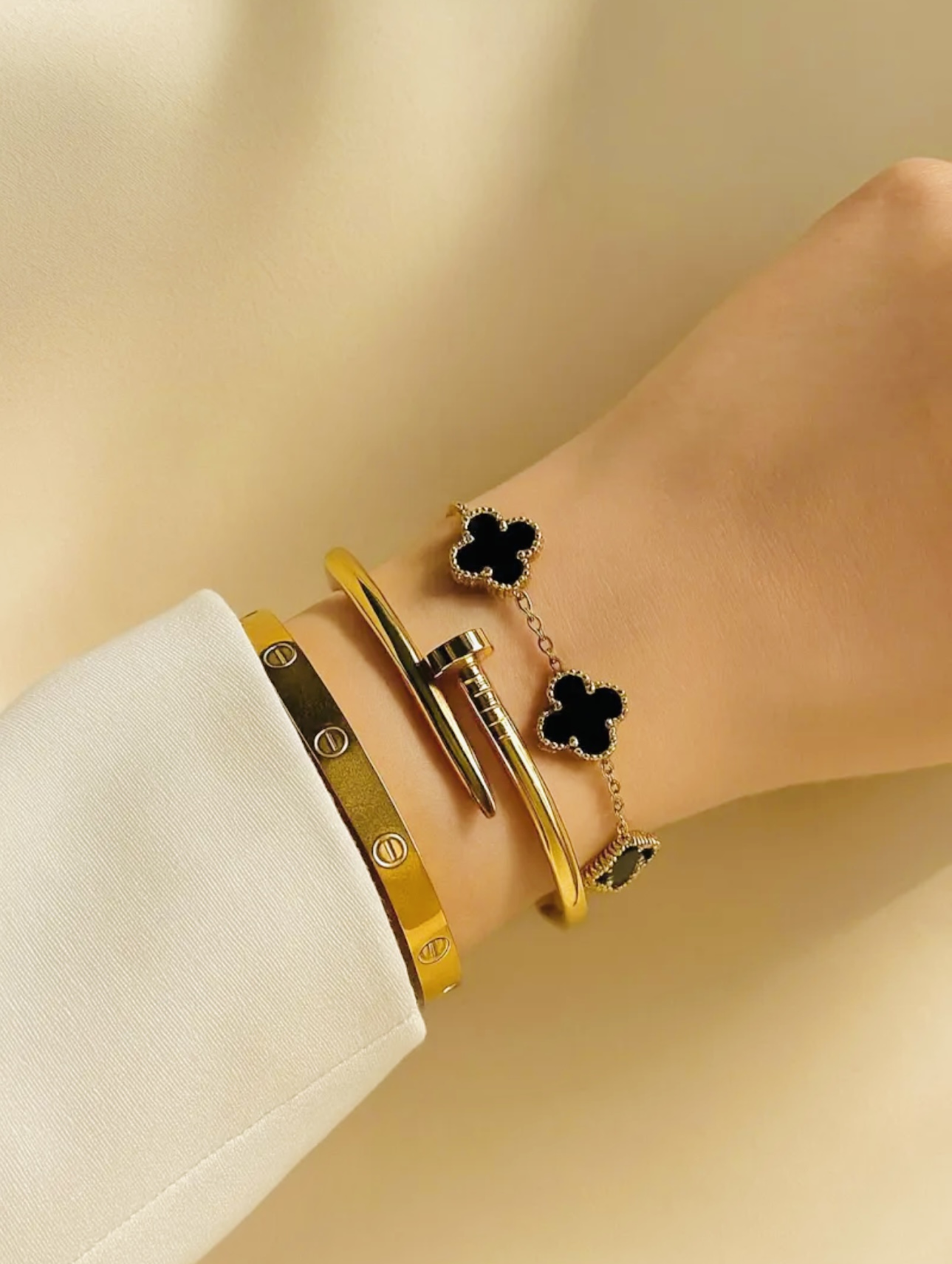 Vastram gold bangles stacked on wrist